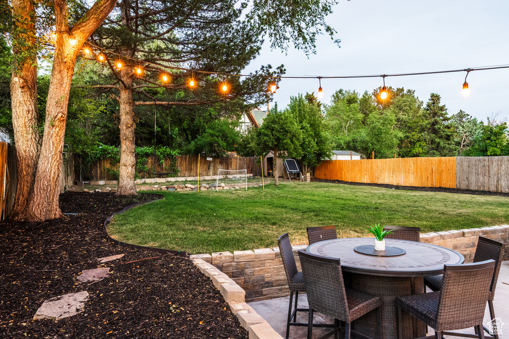 Fenced backyard featuring a patio and outdoor dining space