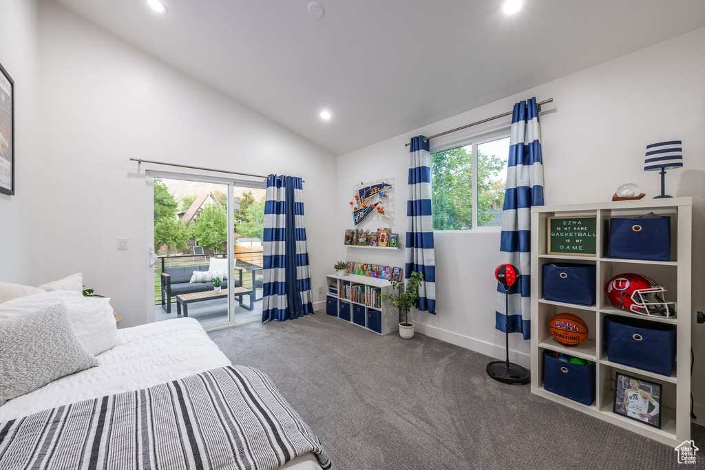 Carpeted bedroom featuring access to outside, recessed lighting, and high vaulted ceiling