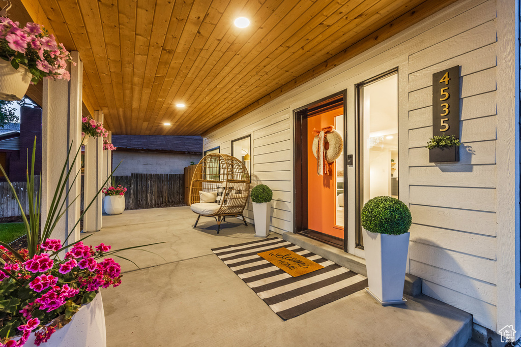 Property entrance with covered porch