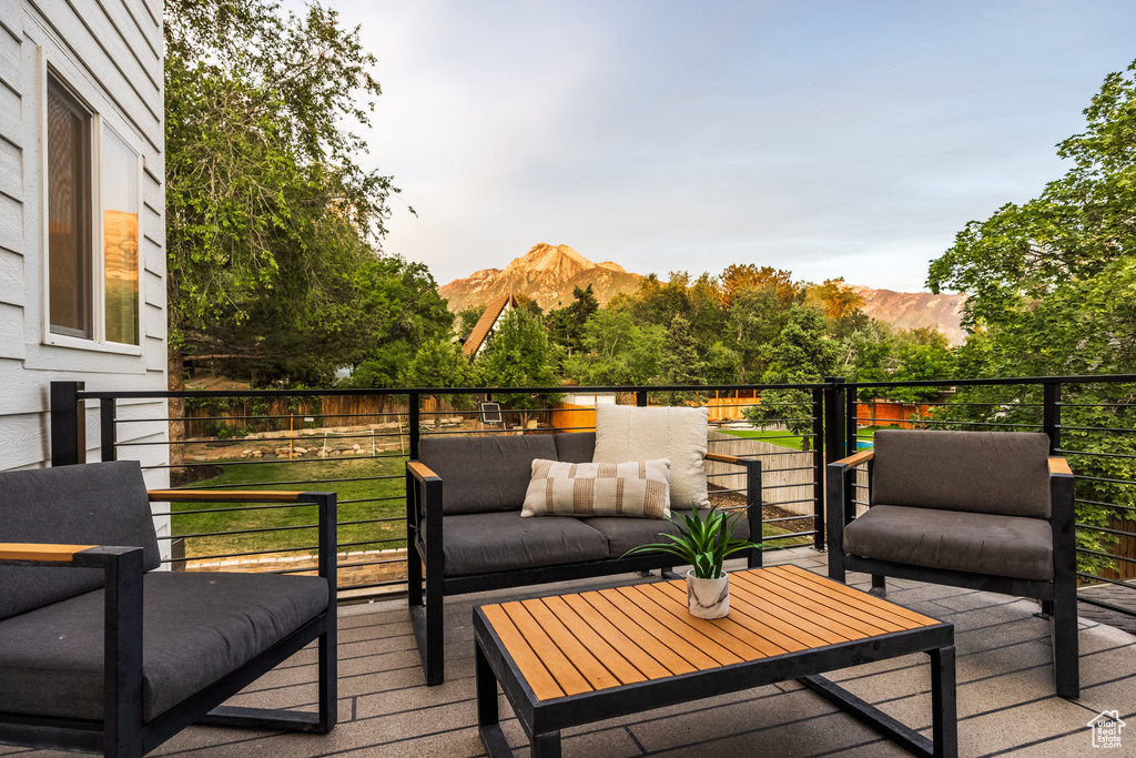 Wooden terrace featuring a mountain view