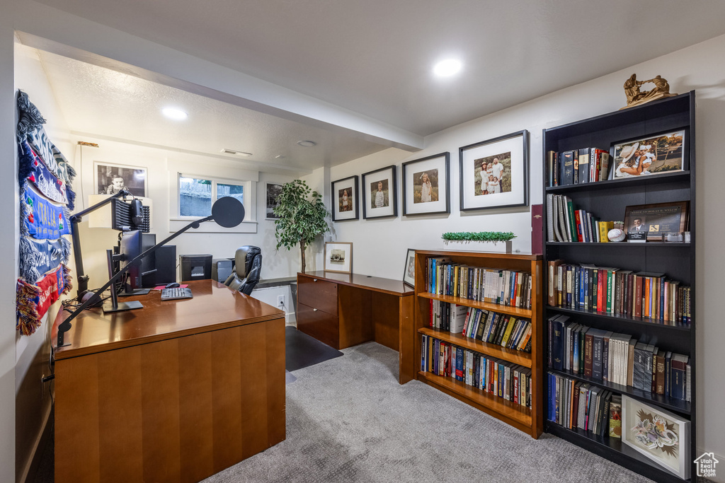 Carpeted office with recessed lighting