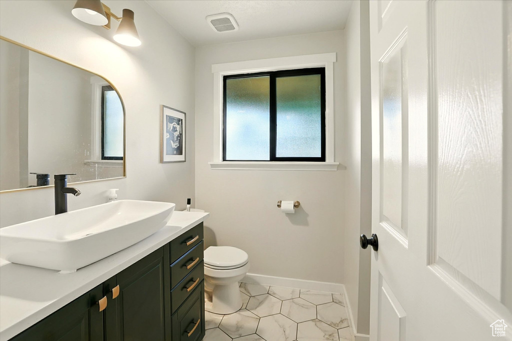 Bathroom featuring vanity and tile patterned floors