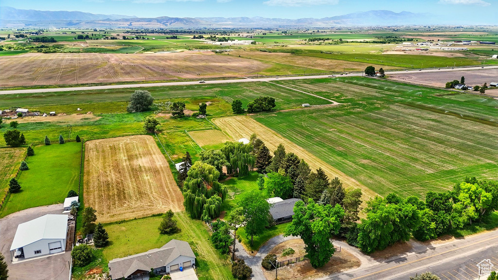 View of rural area with extensive farmland and a mountain backdrop
