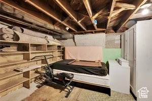 Unfinished below grade area with separate washer and dryer