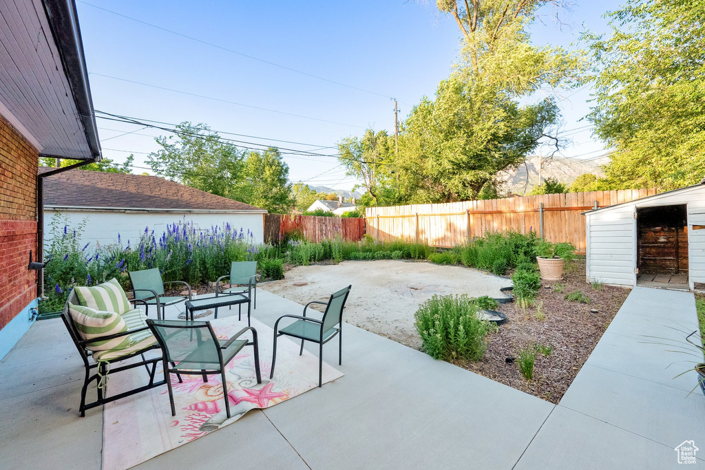 Fenced backyard with a patio