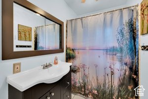 Full bath featuring vanity, tile patterned flooring, and a shower with shower curtain