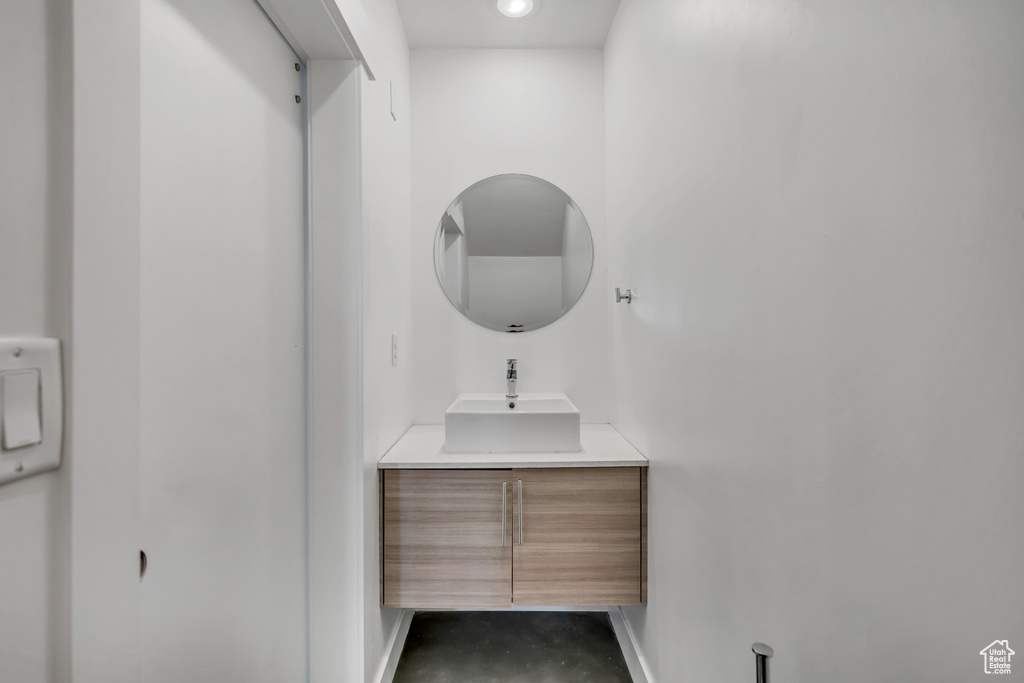 Bathroom featuring vanity and concrete flooring