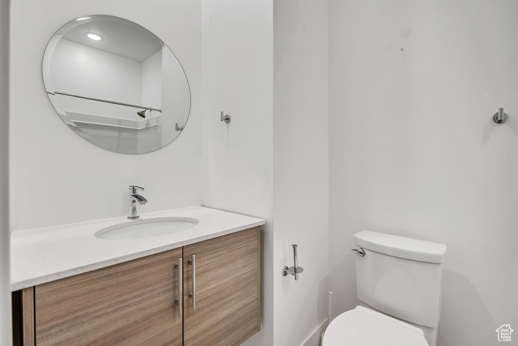 Bathroom with vanity and toilet