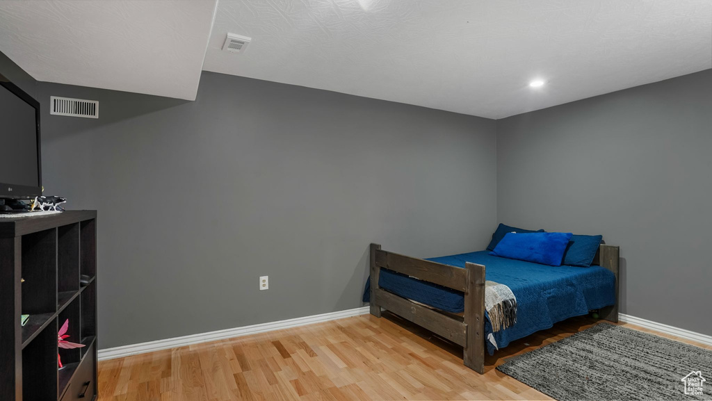 Bedroom with wood finished floors
