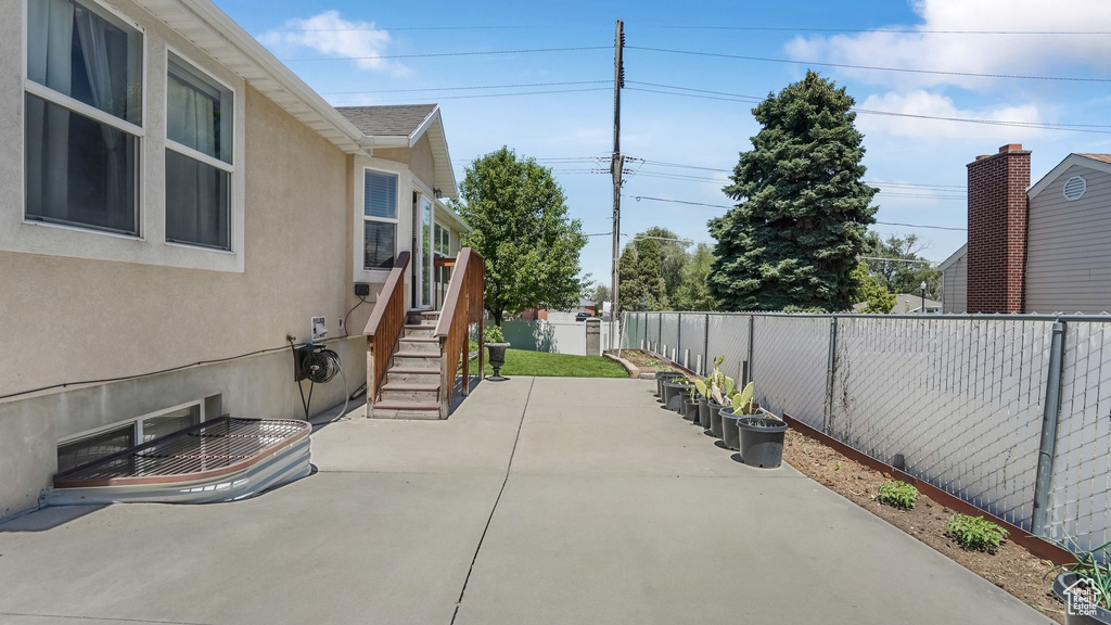 Fenced backyard featuring a patio area