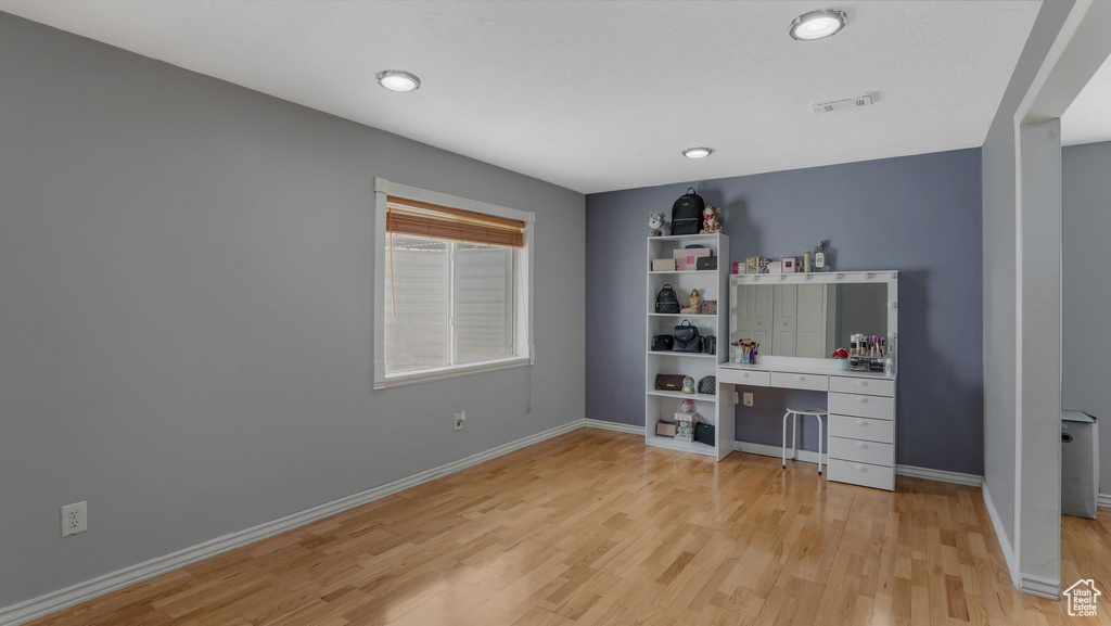 Unfurnished office featuring light wood finished floors and recessed lighting