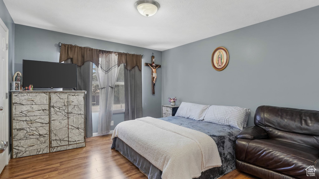 Bedroom with wood finished floors
