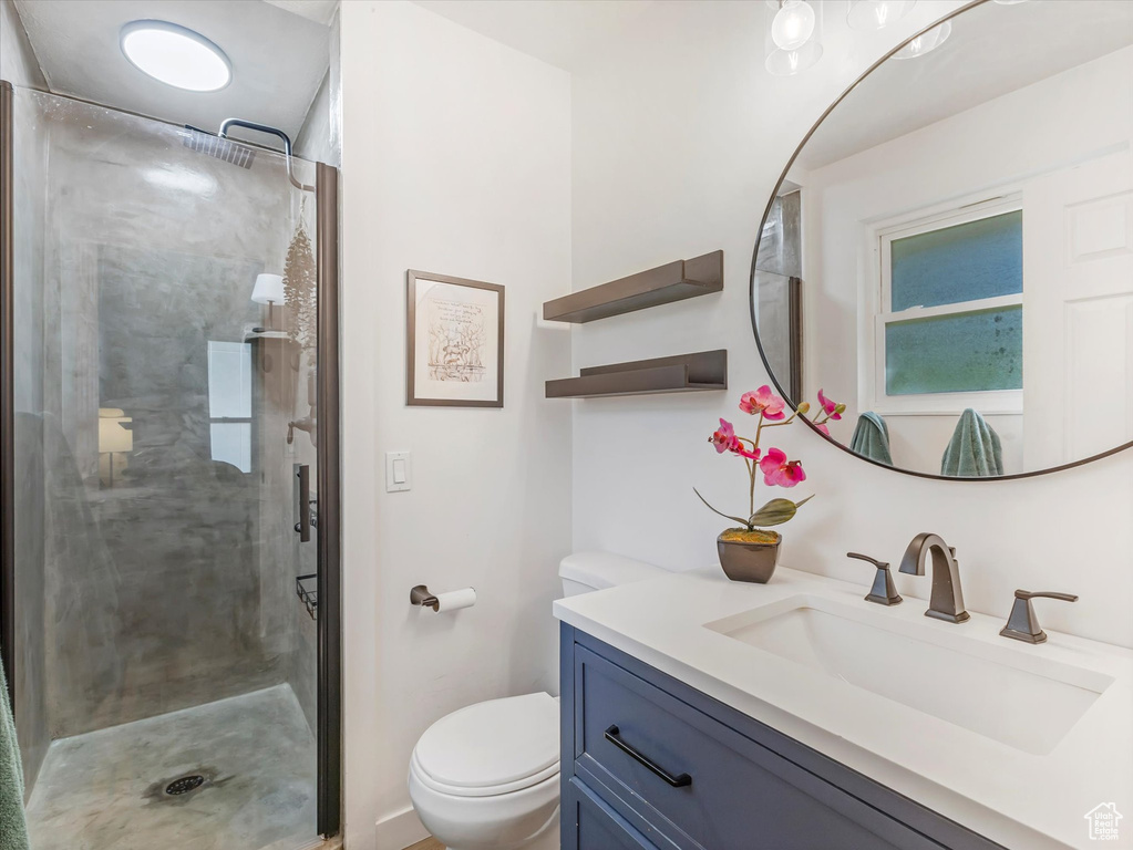 Bathroom with a stall shower and vanity