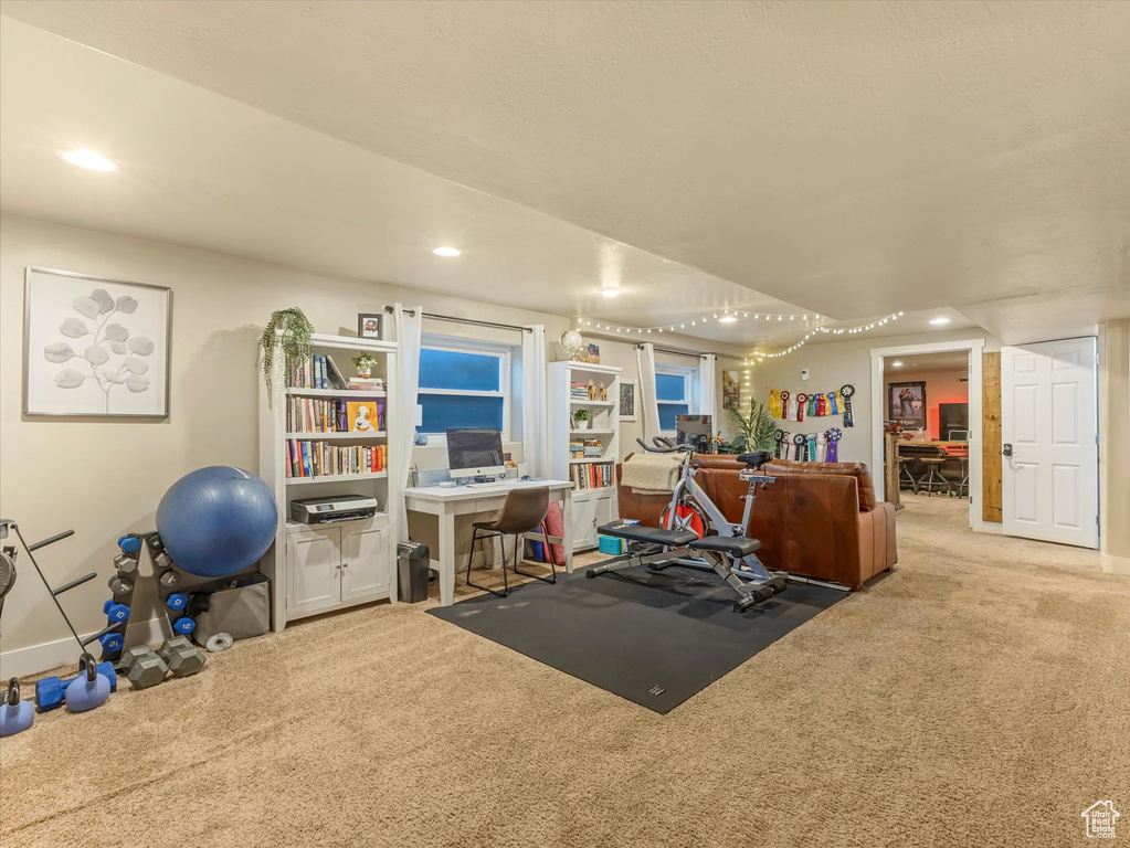 Workout room with carpet flooring and recessed lighting