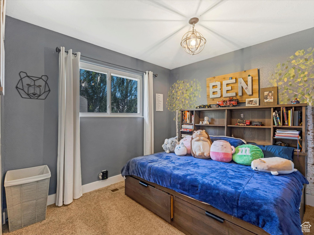 Carpeted bedroom with baseboards