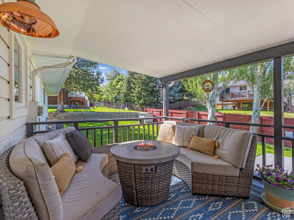 View of patio / terrace featuring an outdoor living space with a fire pit
