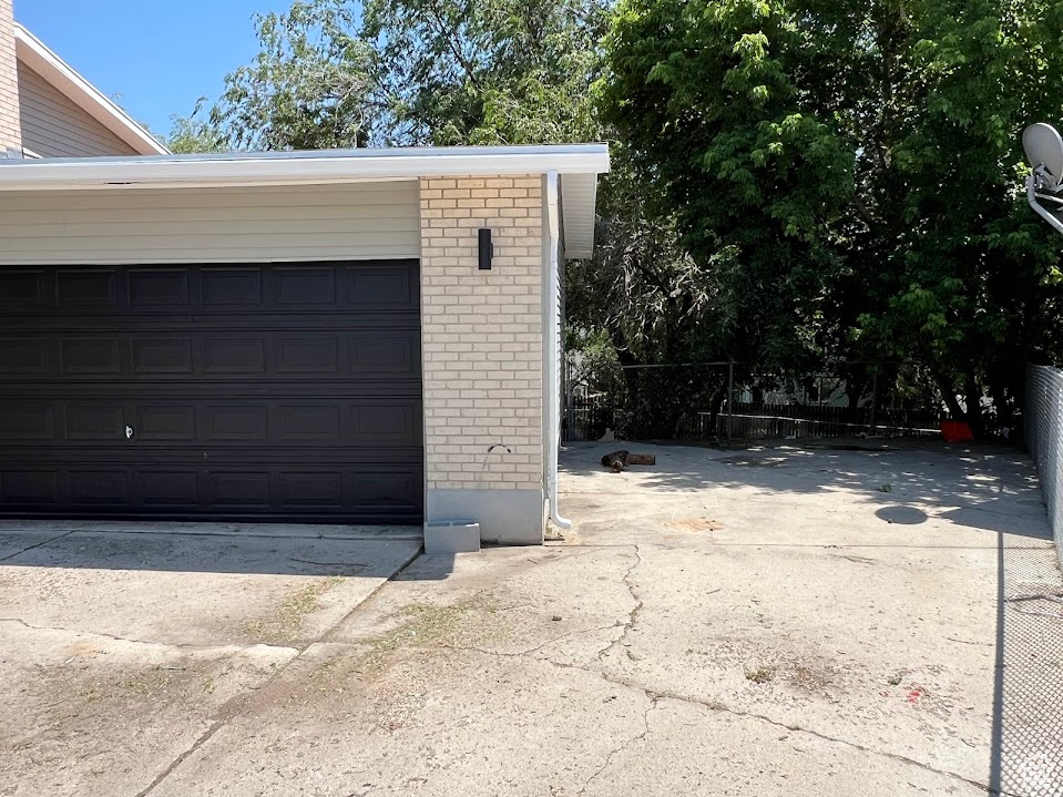 Garage with concrete driveway