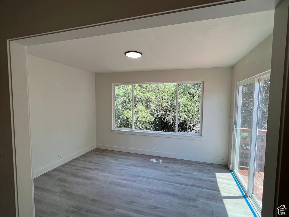 Spare room with wood finished floors
