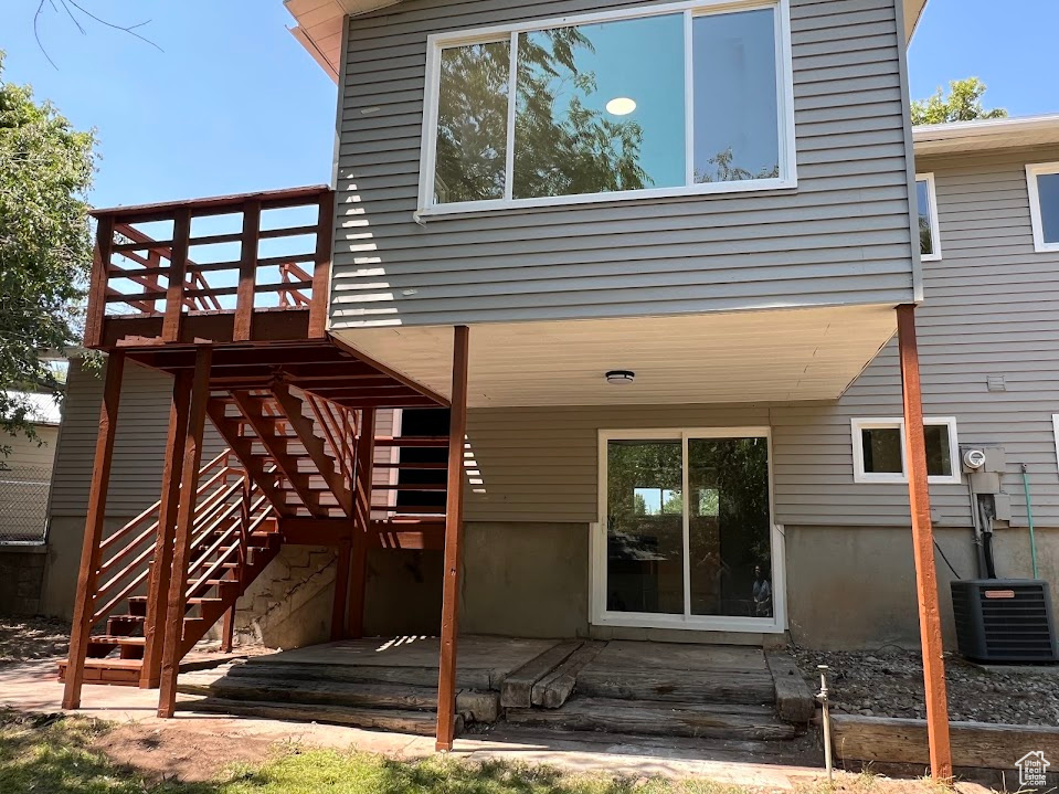 Rear view of house featuring a deck