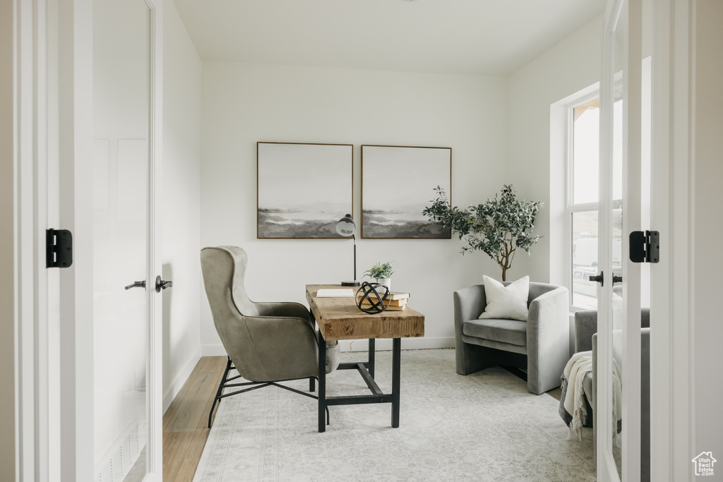 Living area featuring a desk and wood finished floors