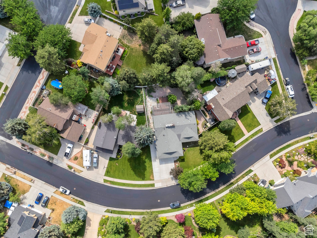 Aerial view of property and surrounding area with nearby suburban area