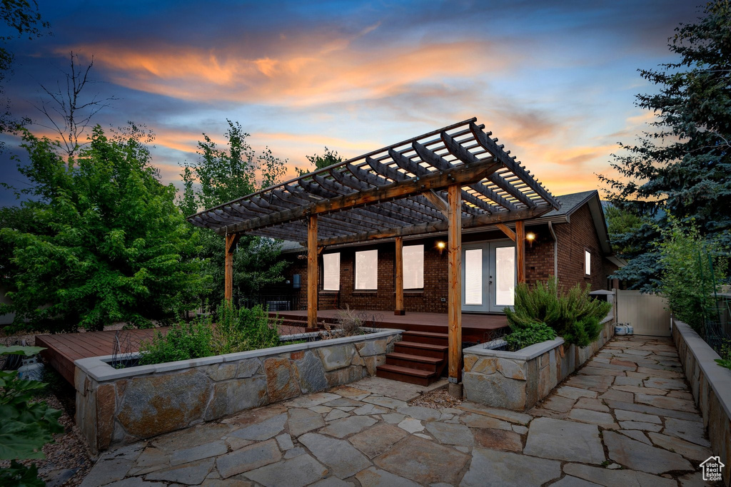 View of patio with a pergola and french doors