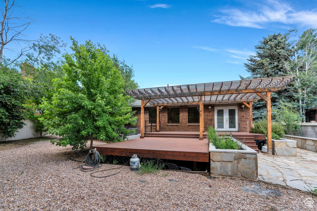 View of patio with a pergola, french doors, and a wooden deck