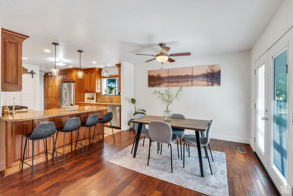 Dining space featuring recessed lighting, ceiling fan, and dark wood finished floors