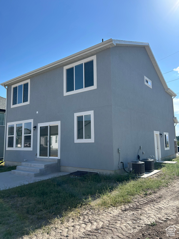 Back of property featuring entry steps
