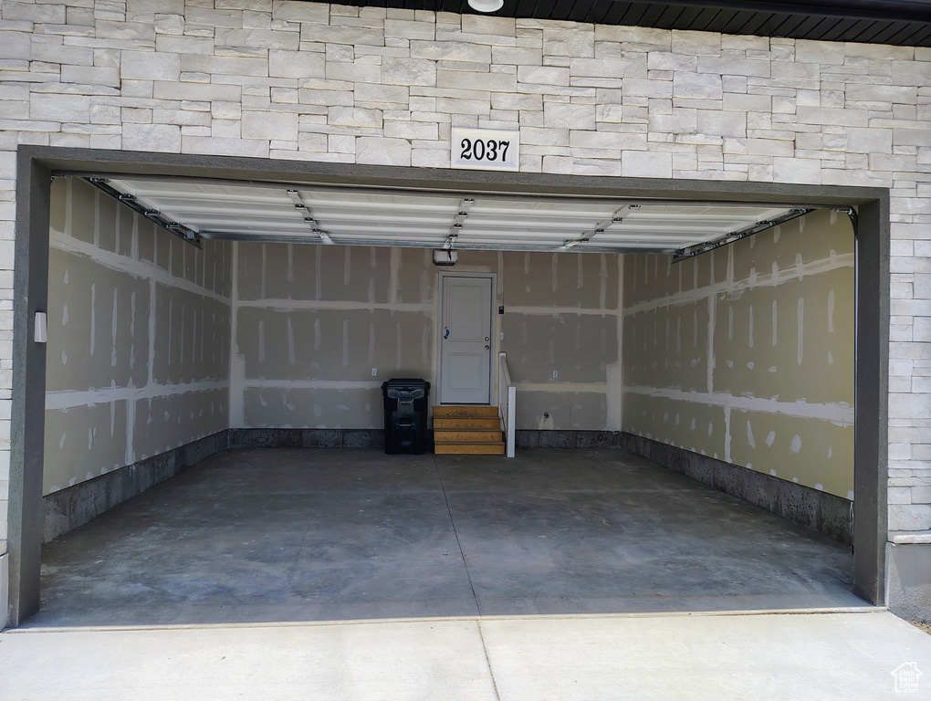 Garage featuring a garage door opener