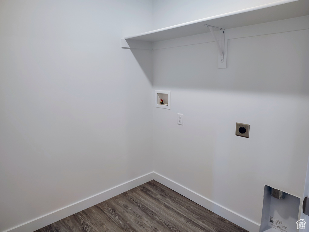 Washroom featuring washer hookup, dark wood-style floors, and electric dryer hookup
