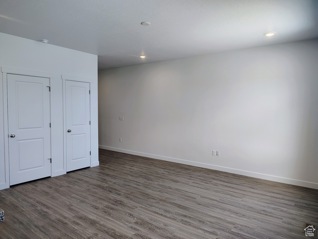 Unfurnished bedroom featuring wood finished floors and recessed lighting