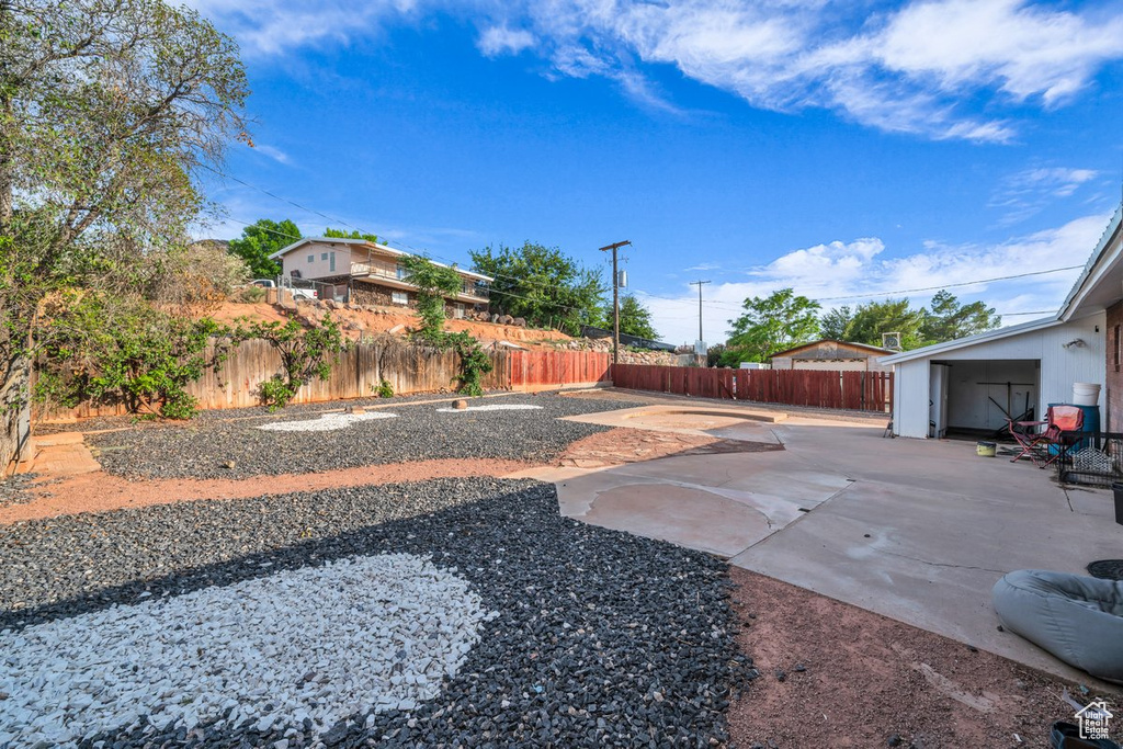 Fenced backyard featuring a patio area