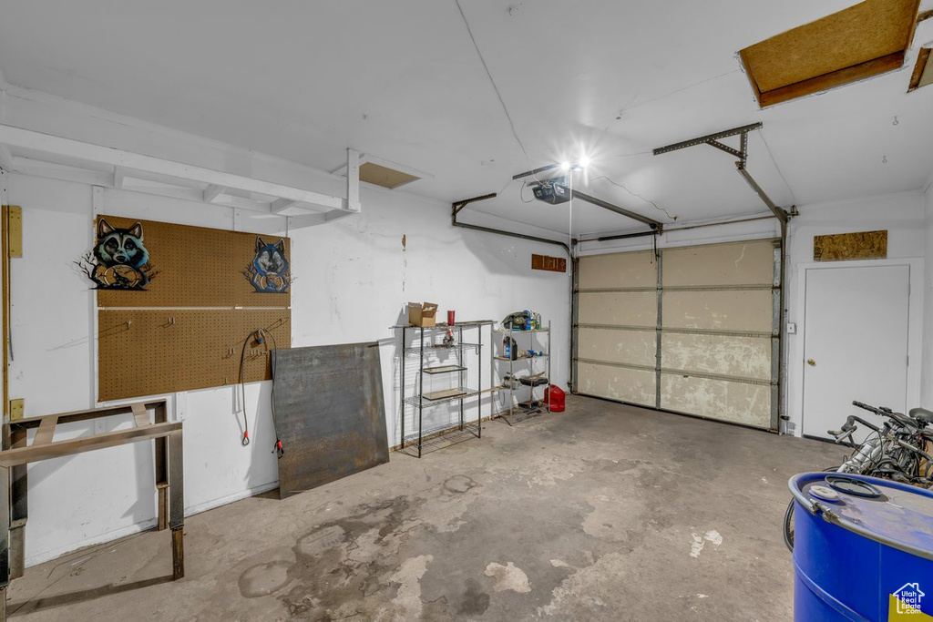Garage featuring a garage door opener