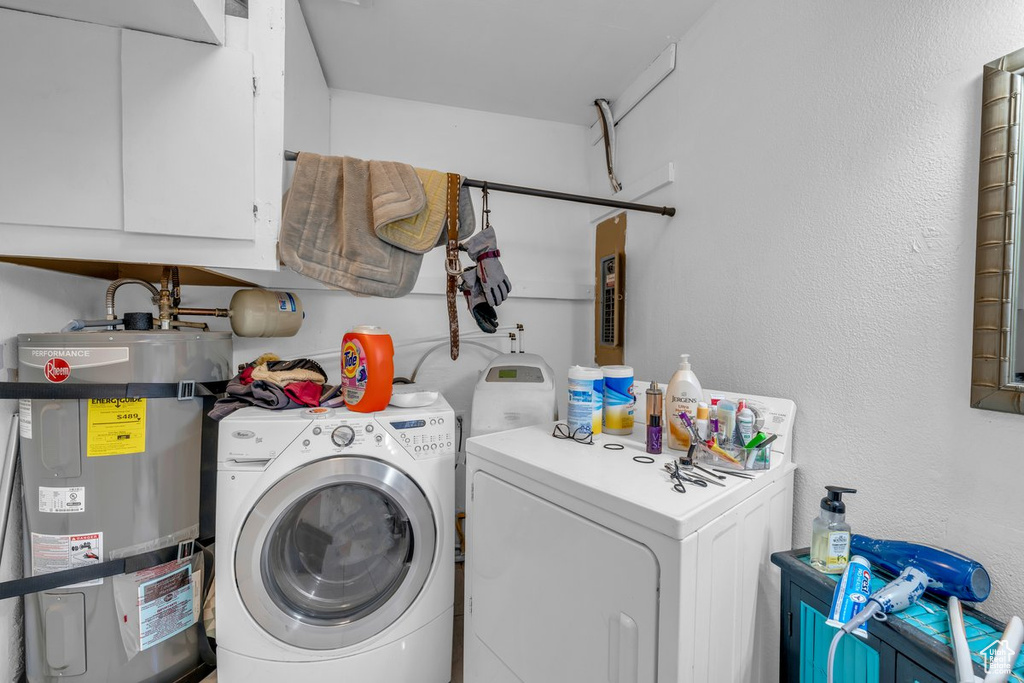 Laundry room with secured water heater, washing machine and clothes dryer, and cabinet space