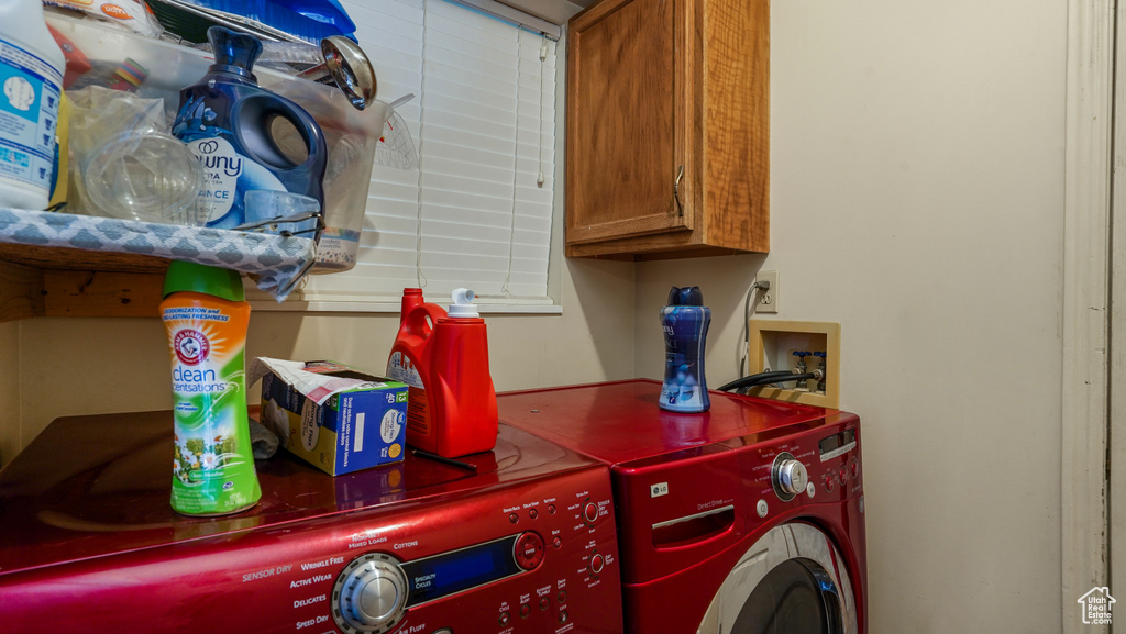 Washroom with washing machine and dryer and cabinet space