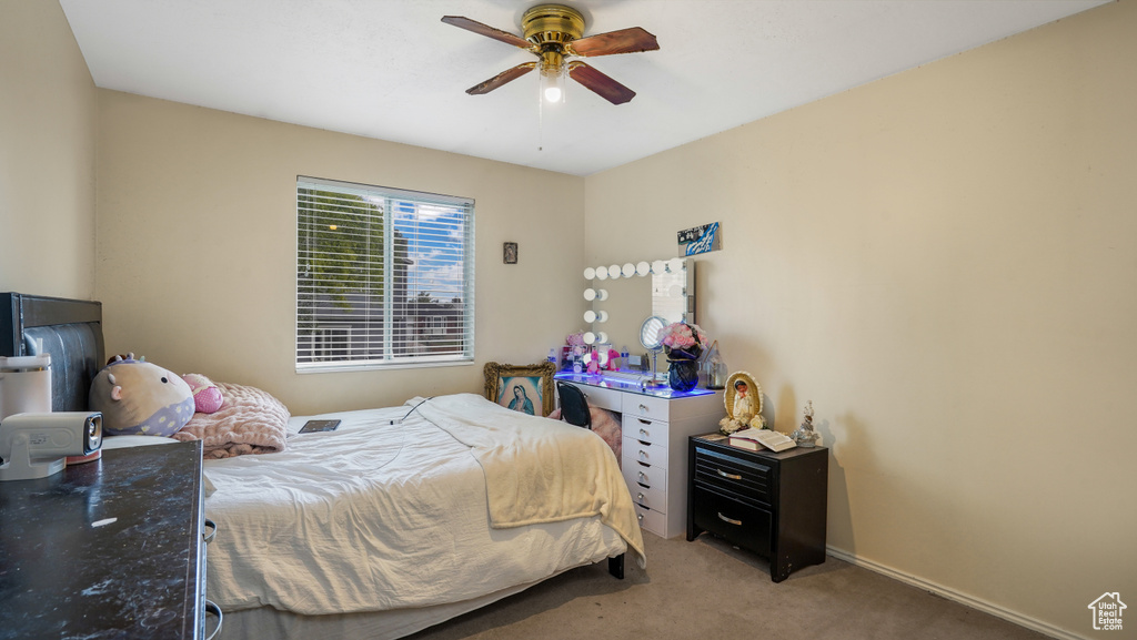 Bedroom with carpet and ceiling fan