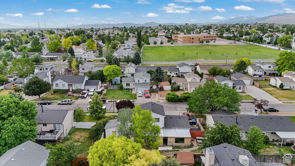 Aerial perspective of suburban area featuring a mountain backdrop