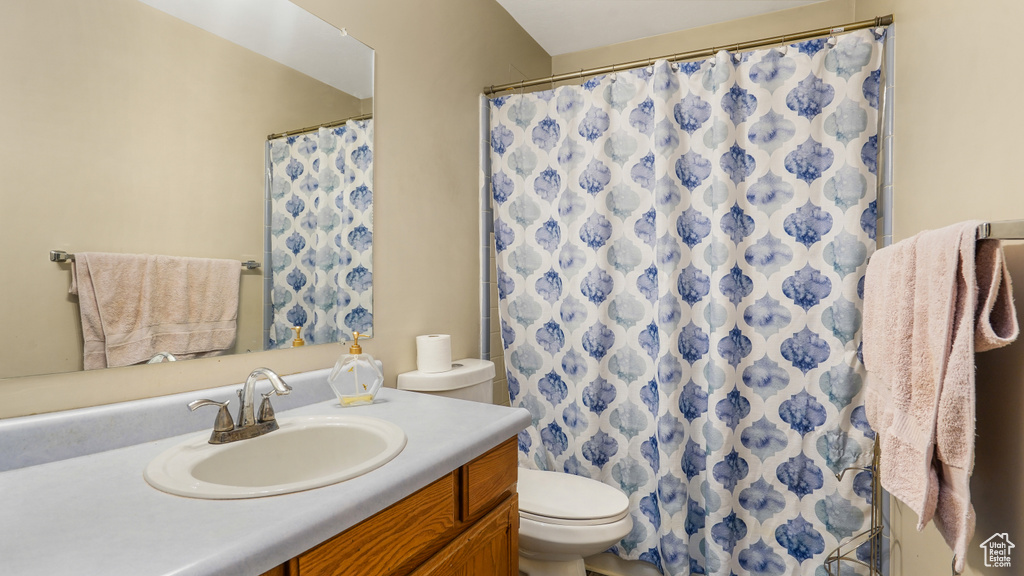 Bathroom featuring vanity and a shower with curtain