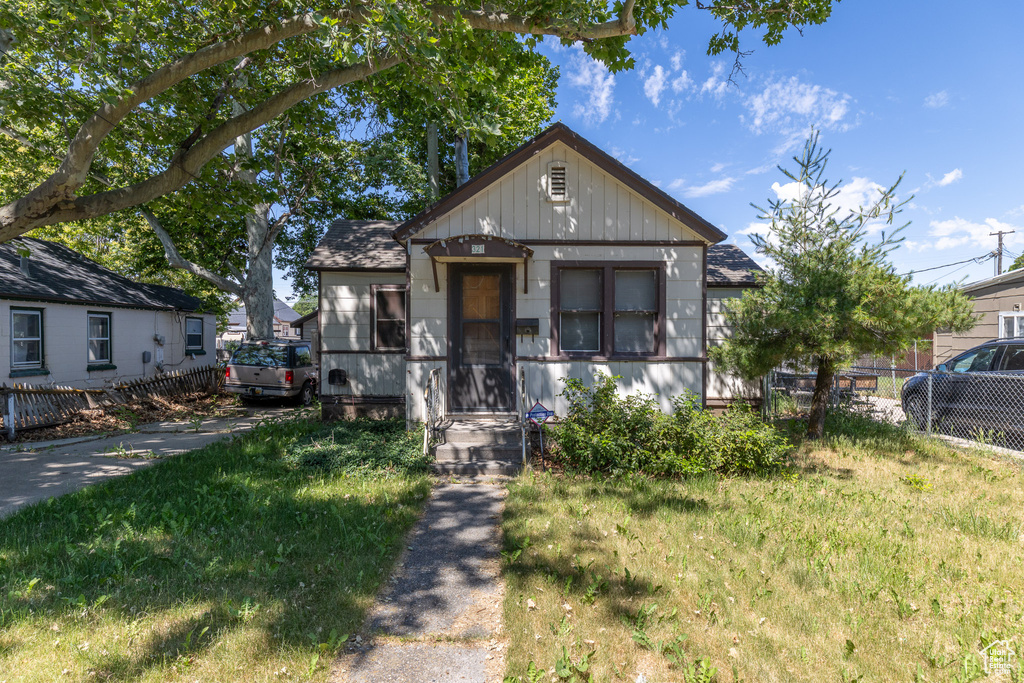 Bungalow-style home with board and batten siding