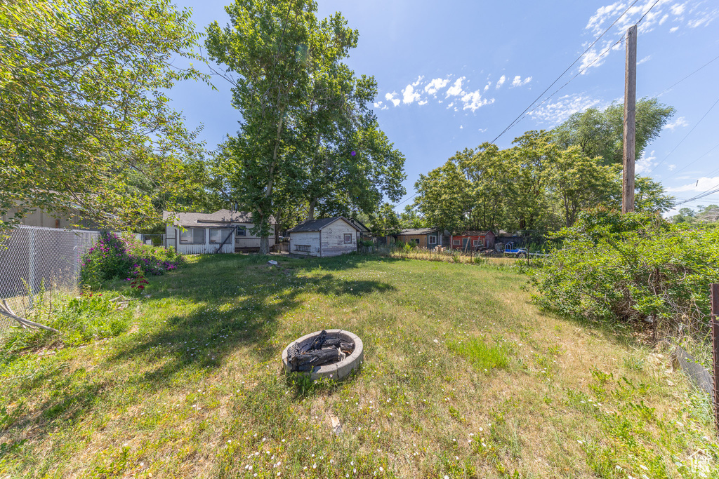View of yard featuring a fire pit
