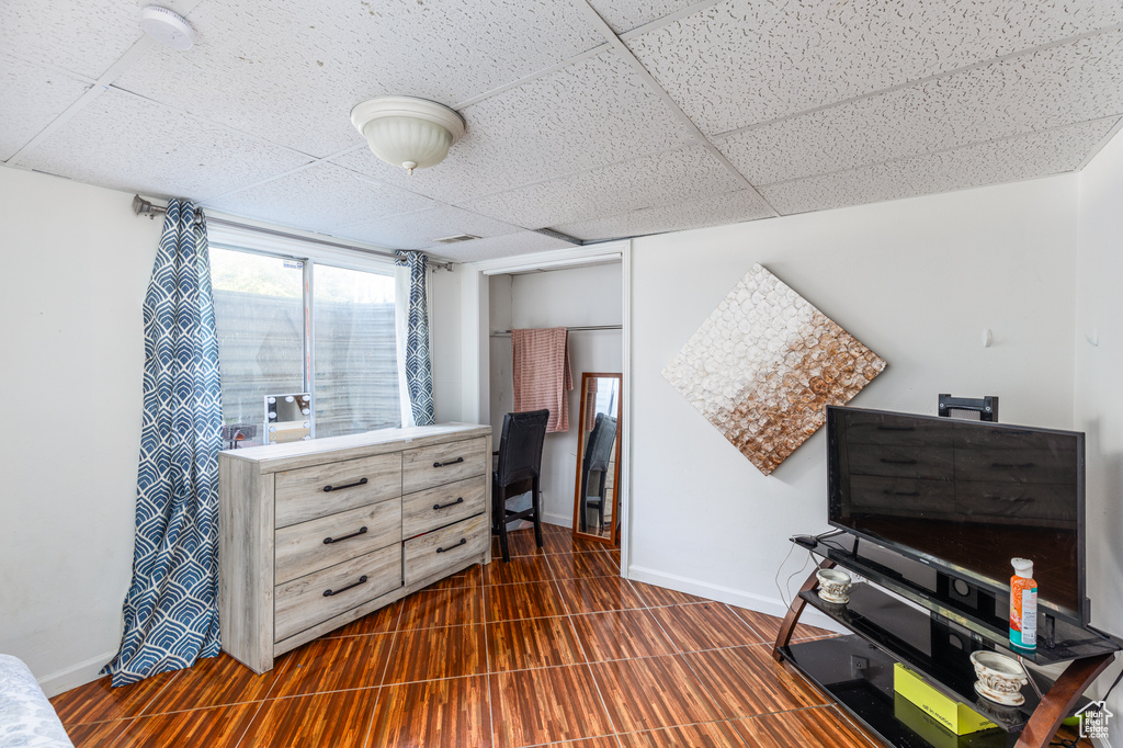 Living area featuring a paneled ceiling