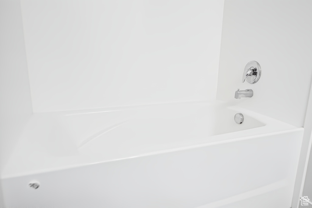 Bathroom with bathing tub / shower combination