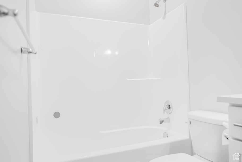 Bathroom with toilet and shower / bath combination