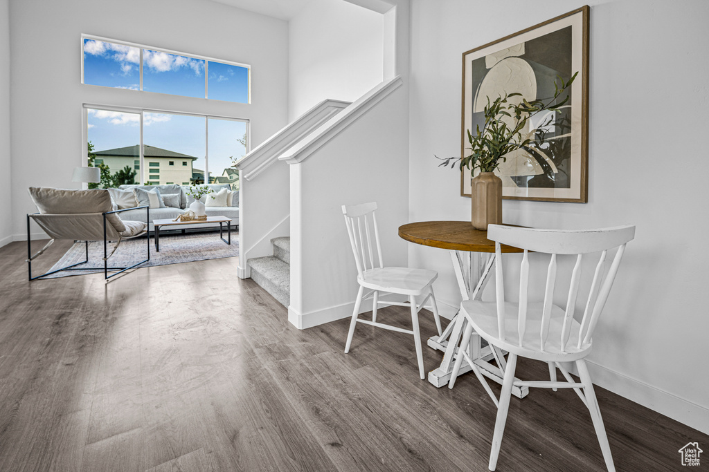 Dining space featuring stairway and wood finished floors
