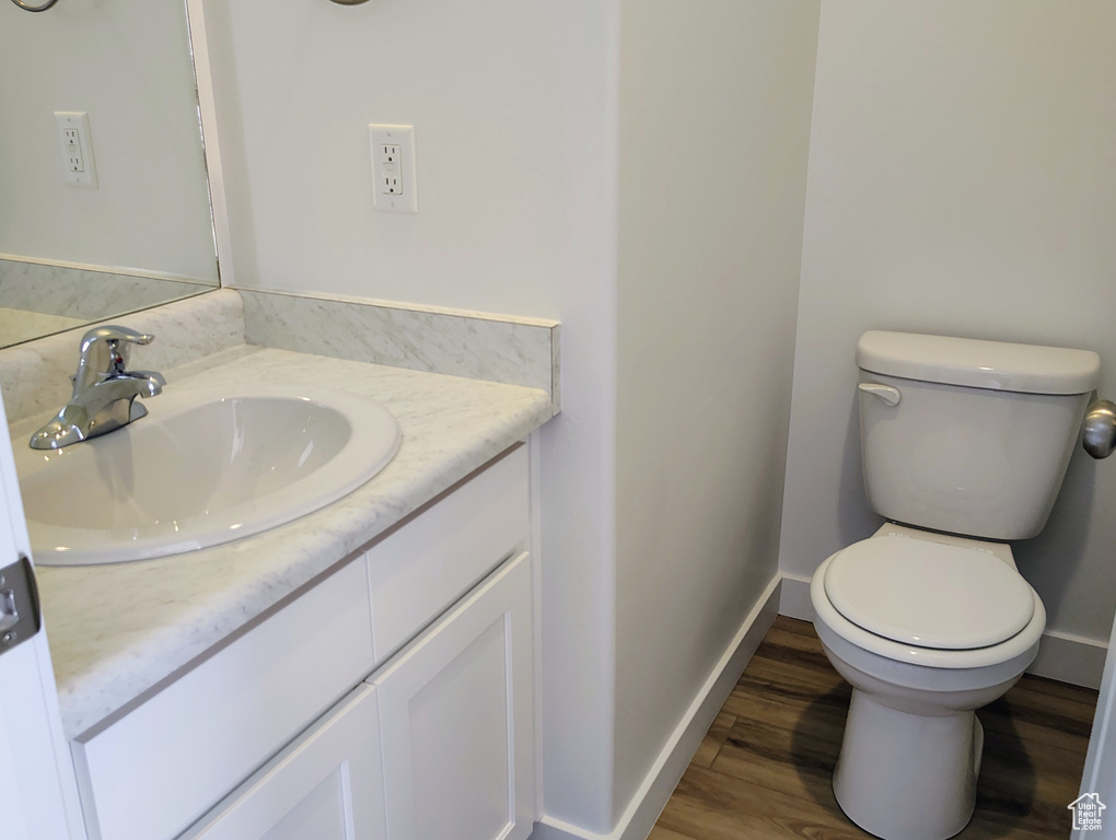 Bathroom with vanity and wood finished floors