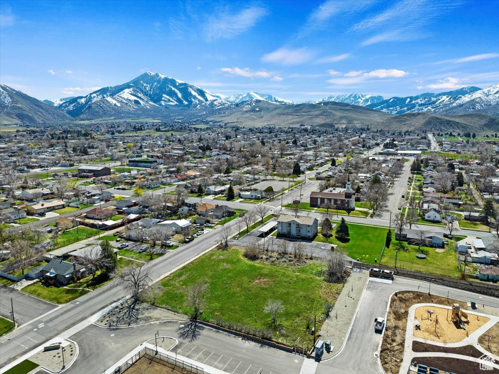 Aerial view of residential area featuring mountains