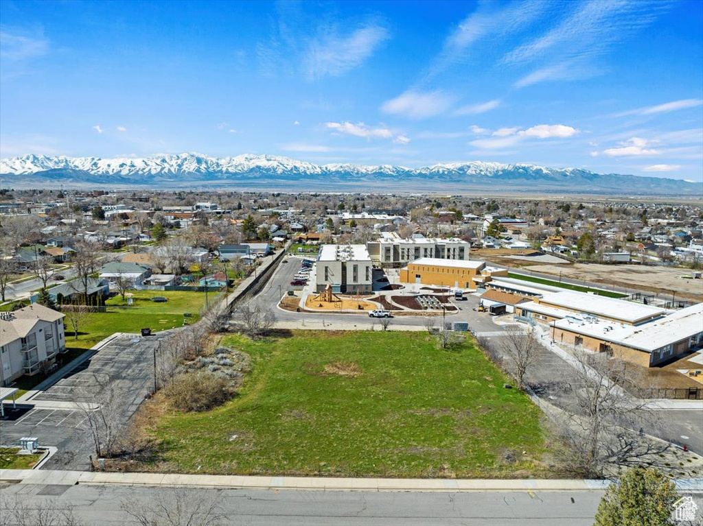 Aerial perspective of suburban area featuring a mountainous background