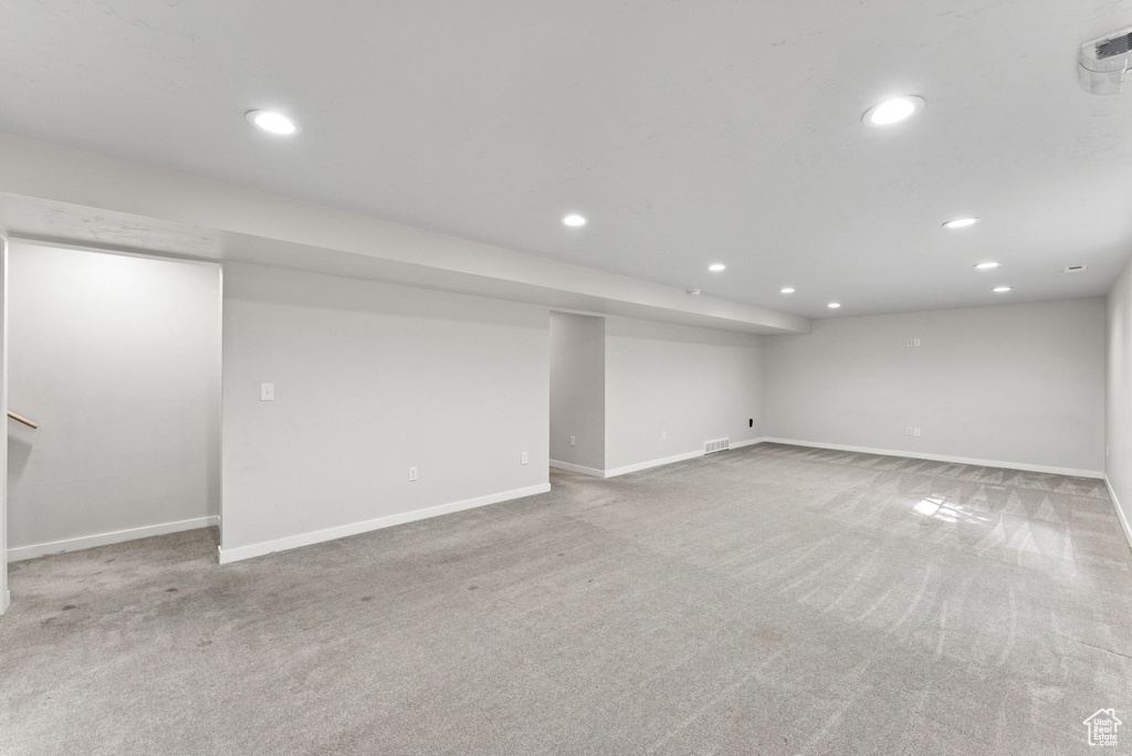 Finished below grade area with carpet floors and recessed lighting