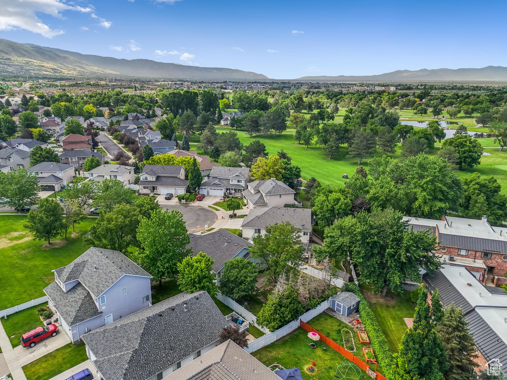 Aerial perspective of suburban area featuring a water and mountain view